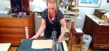 jenny using the baby etching press